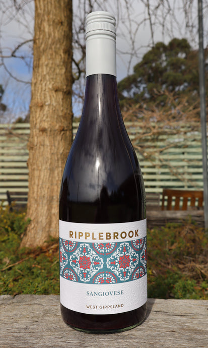 Wine bottle with 'Ripplebrook' label on a wooden surface with a natural background